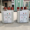 Two assembled 12kV solid insulation indoor vacuum circuit breakers in manufacturing facility