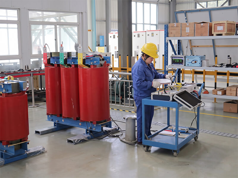 Skilled technician performing precision coil winding for power distribution transformers